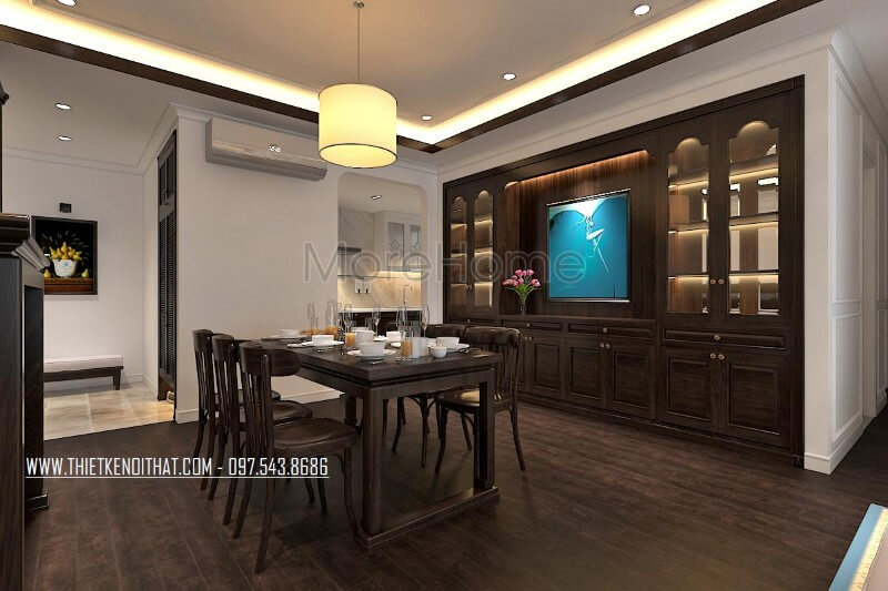 Thiết kế nội thất phòng ăn chung cư theo phong cách gỗ Việt truyền thống, hệ thống tủ gỗ thiết kế âm tường mang đến tính tiện dụng trong sử dụng và góp phần tạo sự sang trọng cho không gian Thiết kế chung cư