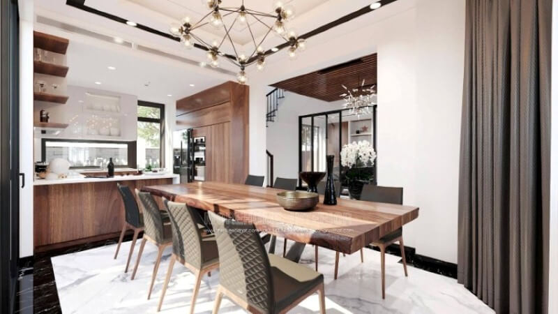 Ngoài điểm đặc biệt từ cách bố trí kệ trang trí, bàn đảo bằng đá nhân tạo màu trắng được thiết kế nhô ra ngoài lại là điểm đáng chú ý, một mặt vẫn đảm bảo diện tích để chủ nhân có thể trưng bày món ăn thỏa mái, một mặt bạn lại có thể vừa nội trợ vừa có thể để mắt con học một cách dễ dàng. Đá ốp bếp biệt thự