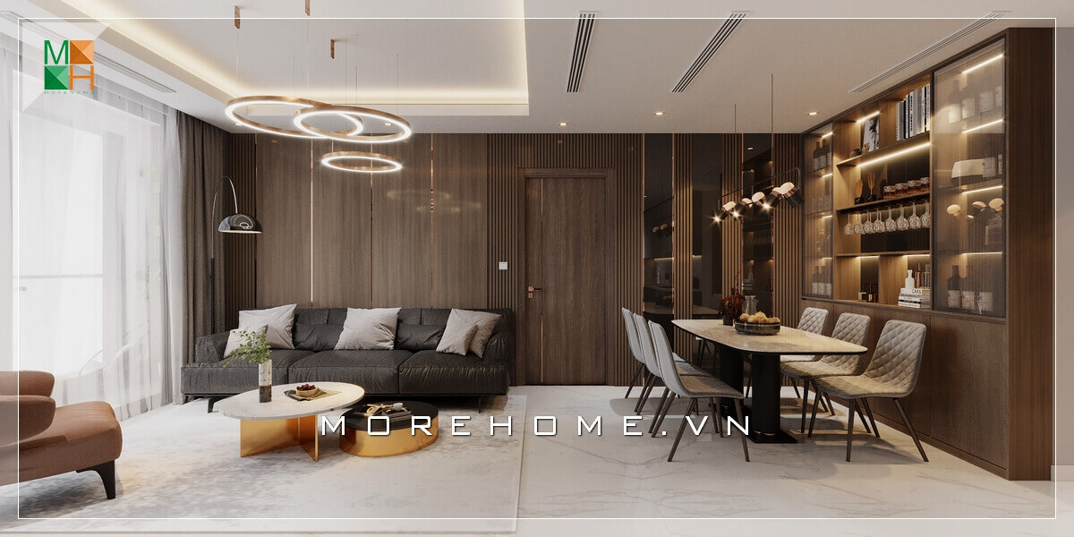 Mẫu thiết kế phòng khách liền phòng ăn được phân chia không gian rõ ràng nhờ hệ thống trần giật cấp và hệ thống đèn thả sang trọng Mẫu nội thất chung cư hiện đại