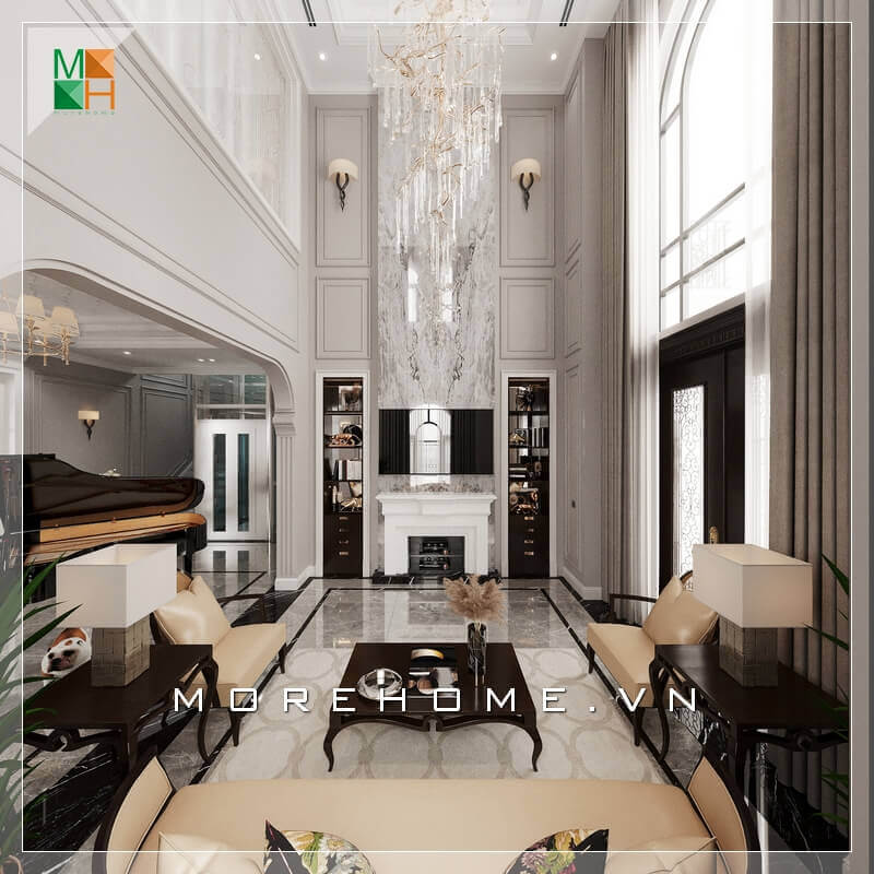 Cách bày trí không gian phòng khách rất tinh tế từ việc sử dụng đèn thả sang trọng, mọi thứ đều hài hòa và phù hợp với phong cách phòng khách tân cổ điển. Gợi ý các mẫu thiết kế phòng khách tân cổ điển tiện nghi