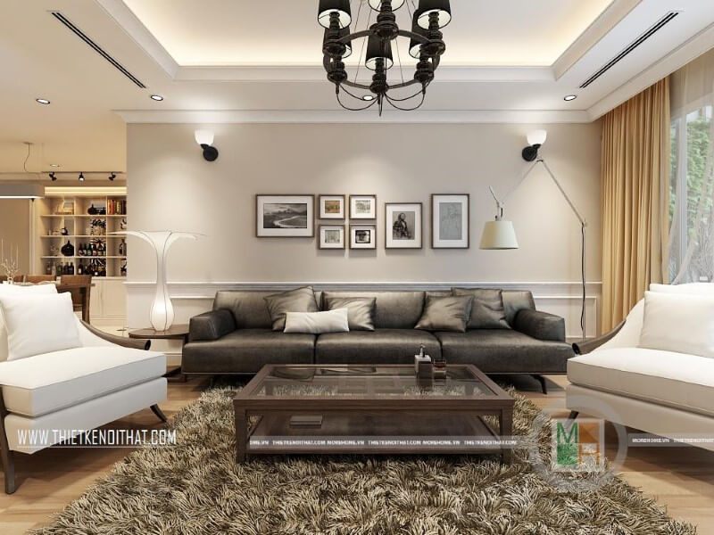 Mẫu thiết kế nội thất phòng khách hiện đại cho chung cư với bộ sofa da cao cấp màu đèn, trắng tạo điểm nhấn nổi bật cho căn phòng.